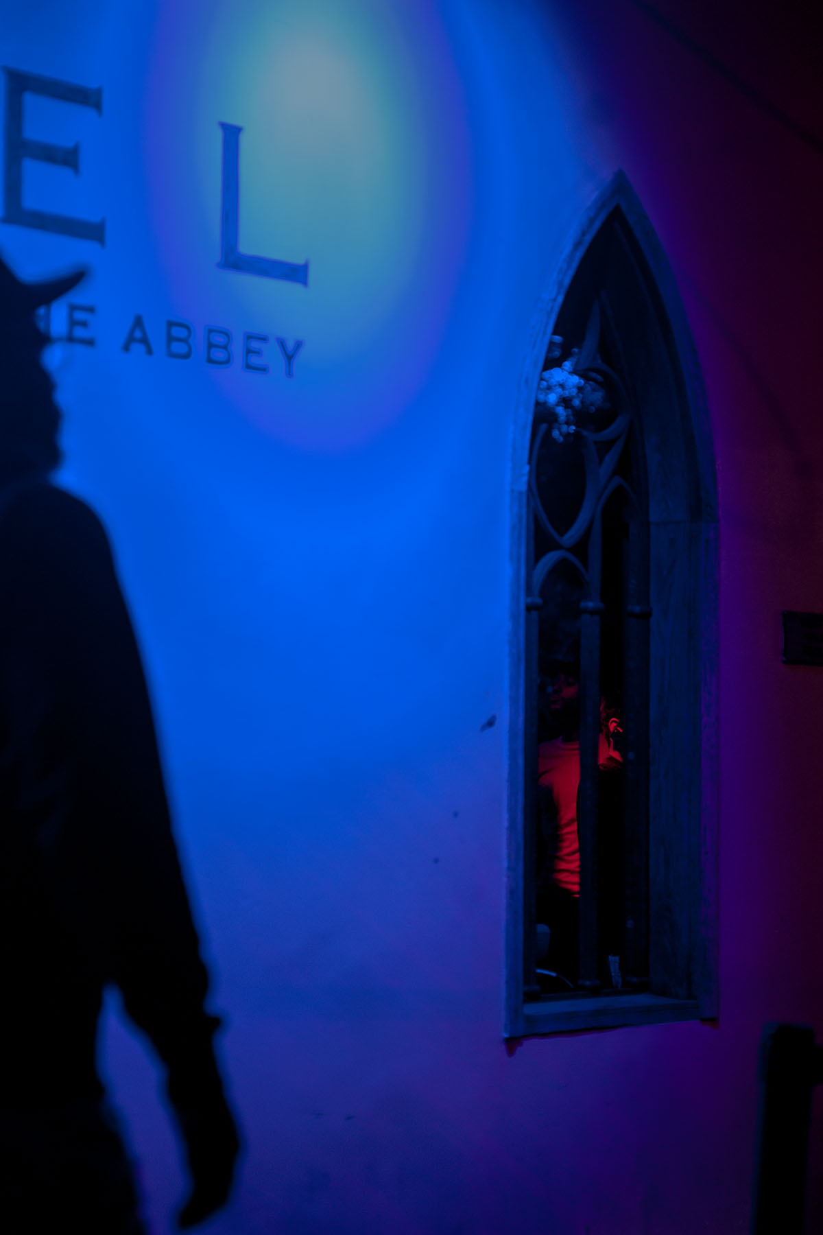A silhouette is seen near the entrance of The Chapel at The Abbey.