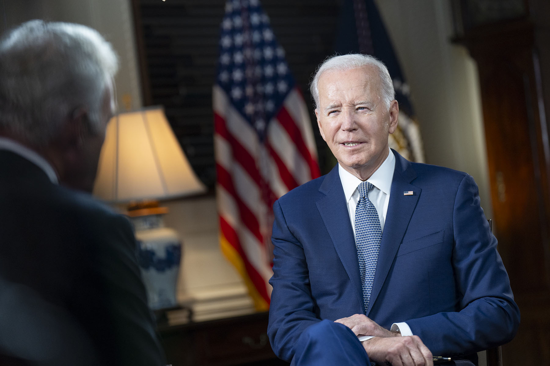 President Joe Biden participates in an interview in the Map Room of the White House.