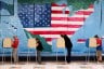 Voters fill out their ballots in front of a giant map of the United States at a polling station on November 7, 2023.