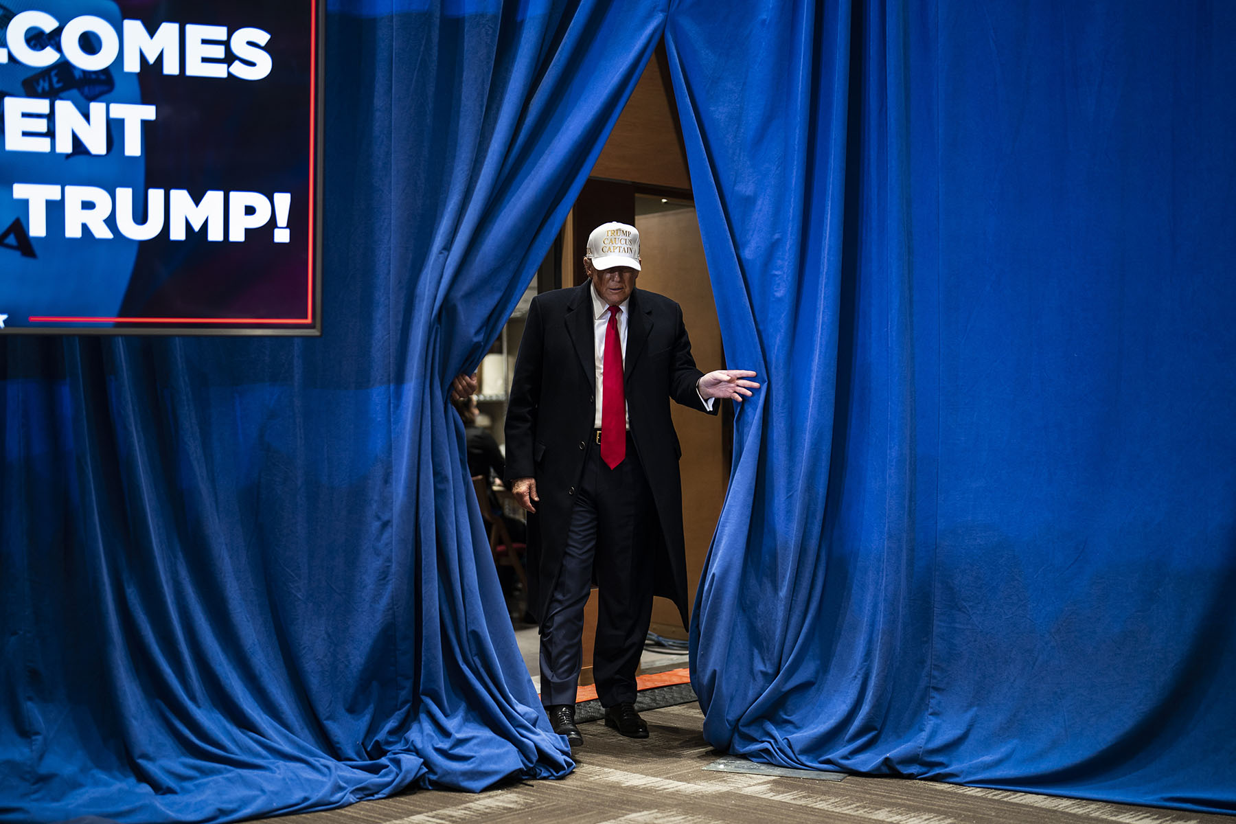 Donald Trump walks out to speak at a campaign rally held at Simpson College in Indianola, Iowa.