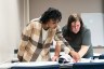Trainee Diamond Hamel learns how to read blueprints in a classroom at Rochester Community and Technical College.