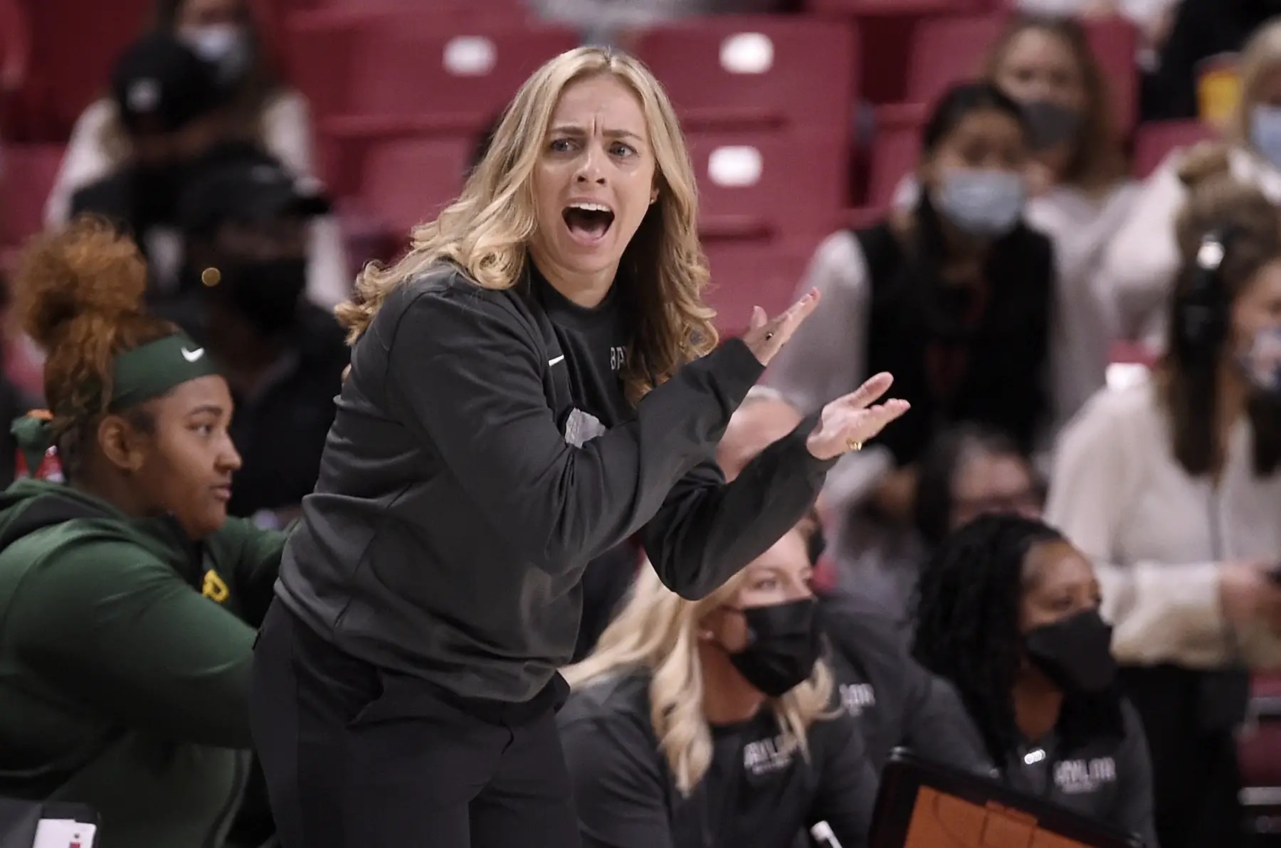 Head coach Nicki Collen of the Baylor Lady Bears watches the basketball game from the sidelines.