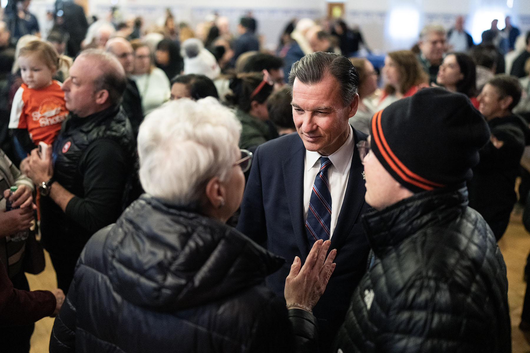 Former Rep. Tom Suozzi talks with supporters during a campaign rally at the Polish National Home.