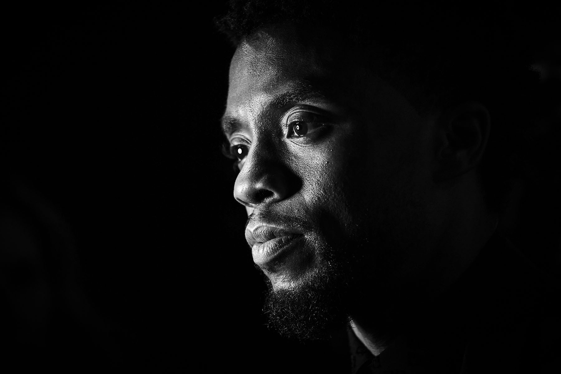 Black and white image of Chadwick Boseman attending the European Premiere of Black Panther in London in 2018.