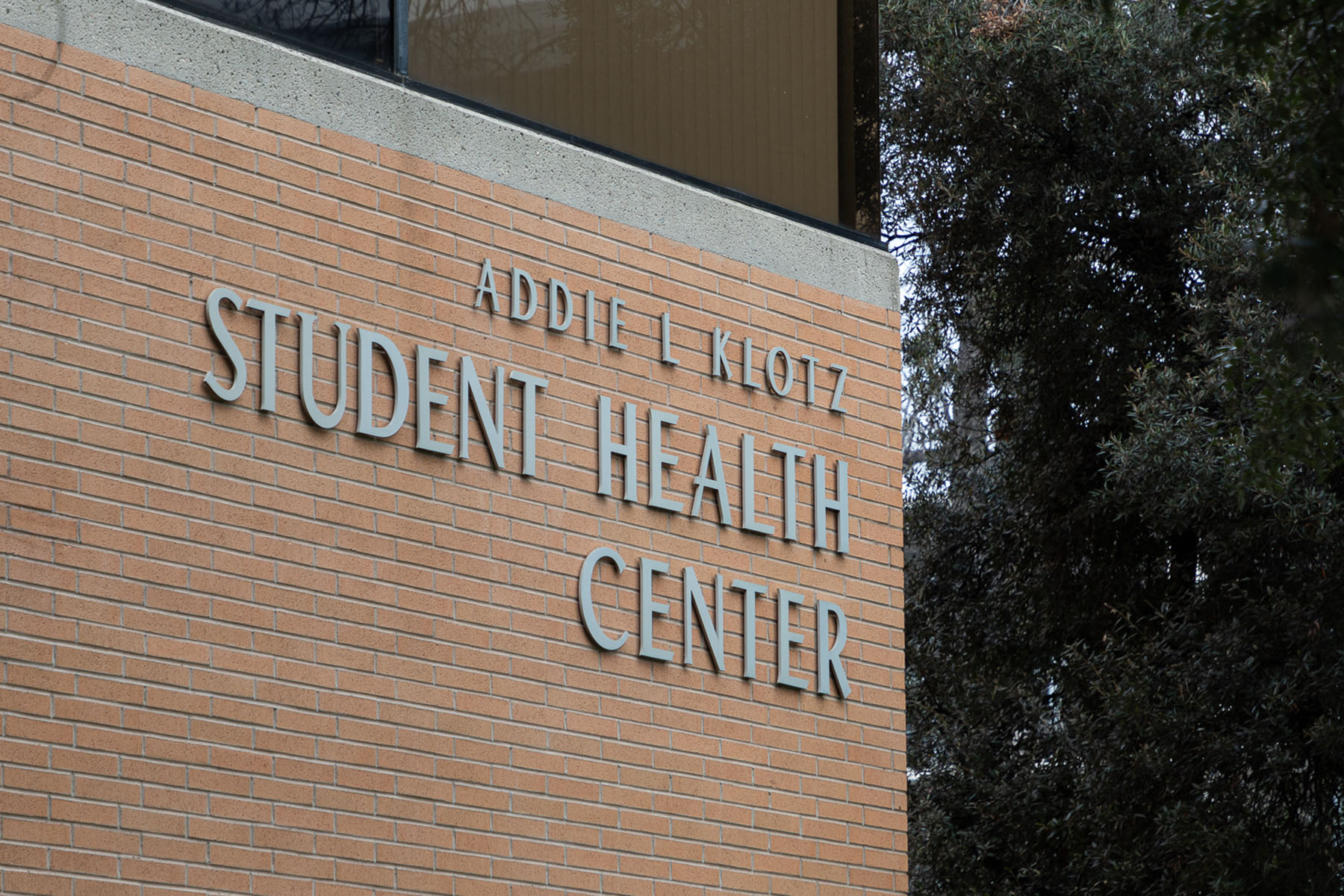 A brick wall with metal lettering that reads "Addie L. Klotz Student Health Center."