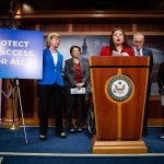Senator Tammy Duckworth speaks during a press conference with other Senate Democrats.
