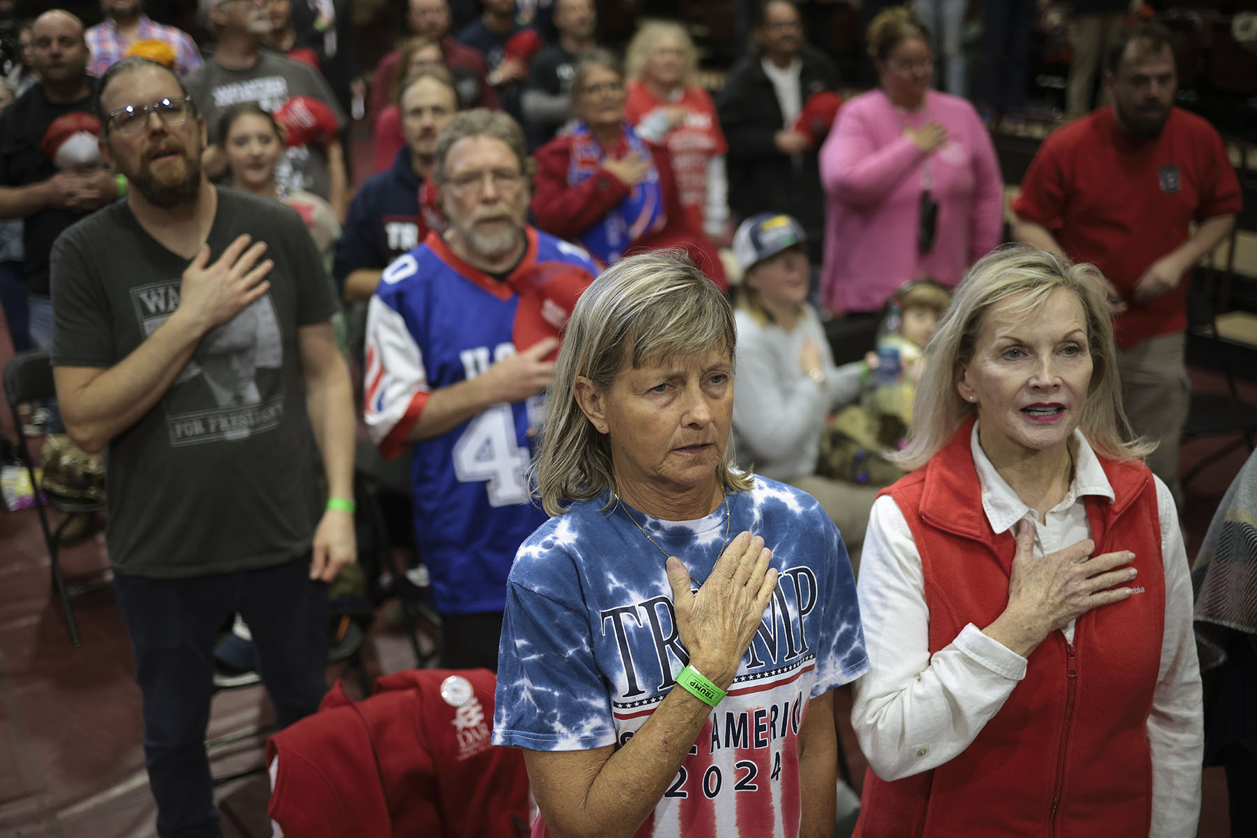 Supporters say the Pledge of Allegiance before Donald Trump speaks at a rally.