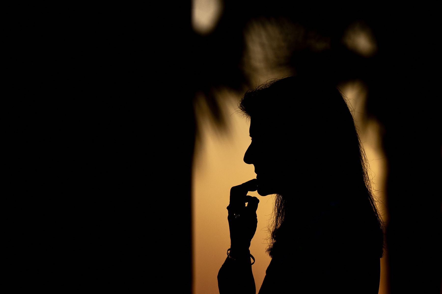 Nikki Haley's silhouette is seen at sunset at a campaign event in Beaufort, South Carolina.