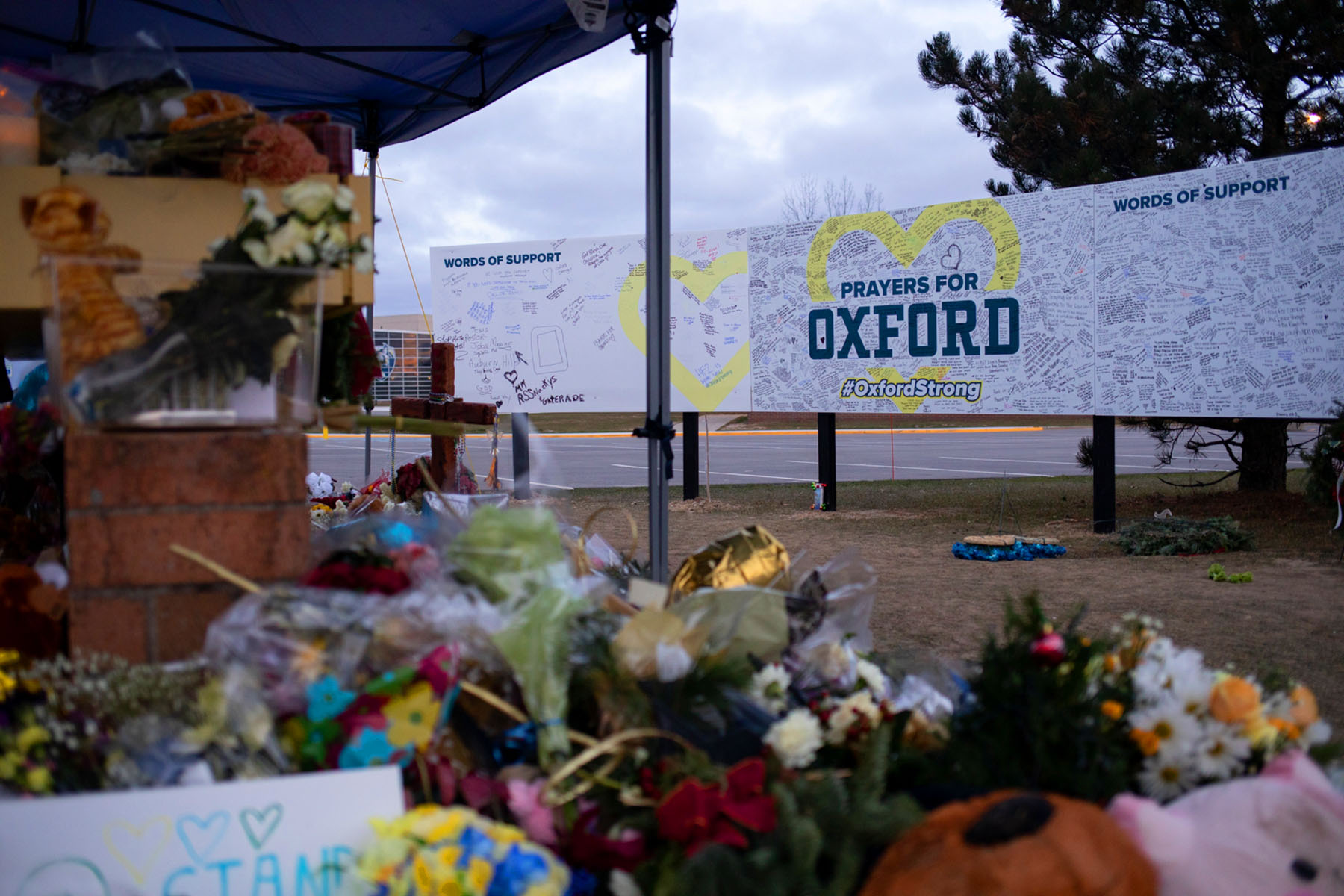 A memorial outside of Oxford High School alongside a board where people can share their words of support is seen in Oxford, Michigan.