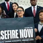 From left, Rep. Cori Bush, Rep. Alexandria Ocasio-Cortez, Rep. Rashida Tlaib, Rep. Barbara Lee and other Democrats pose for a photo with a sign calling for a ceasefire in Gaza outside the Capitol.