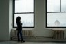 Thalia Gonzalez looks out a window onto New York City.