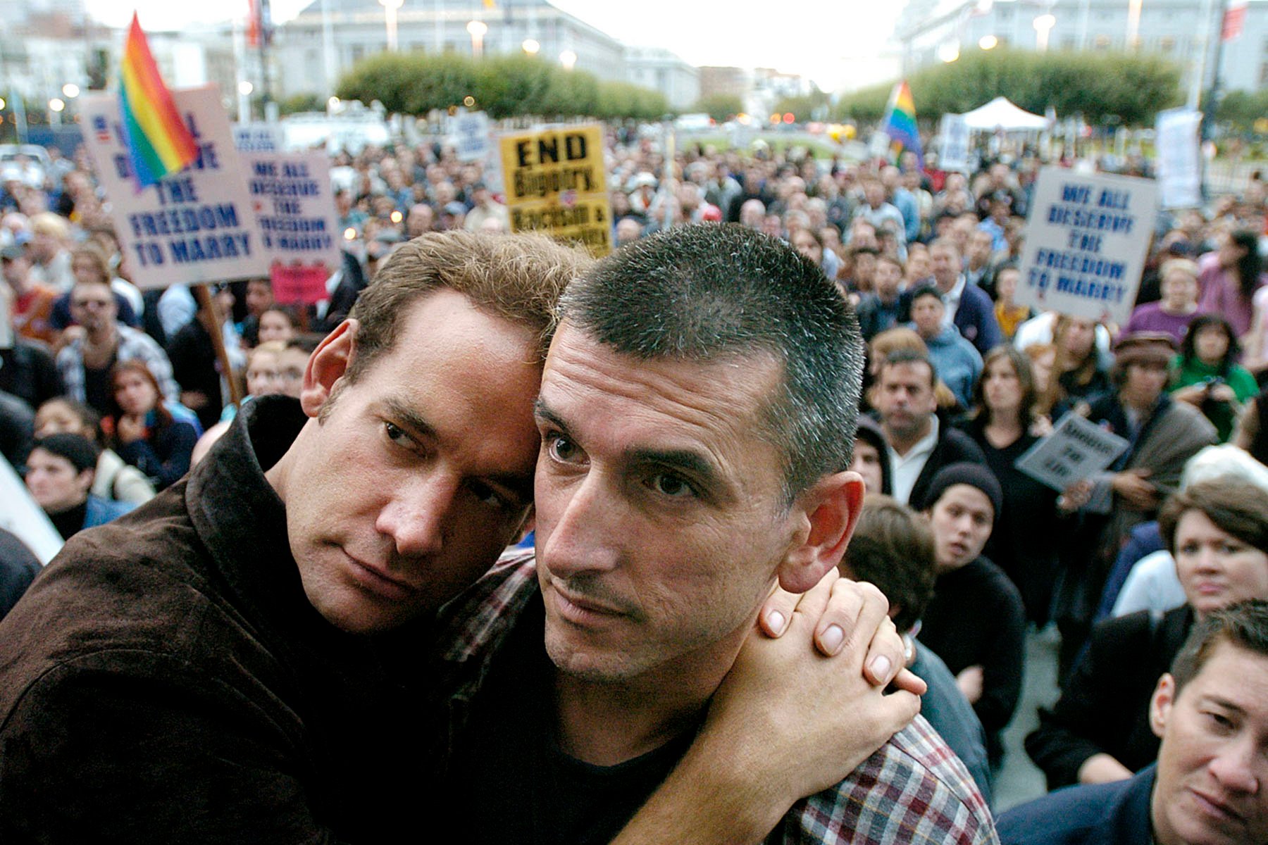 A couple embraces as people rally in support of gay marriage in San Francisco.
