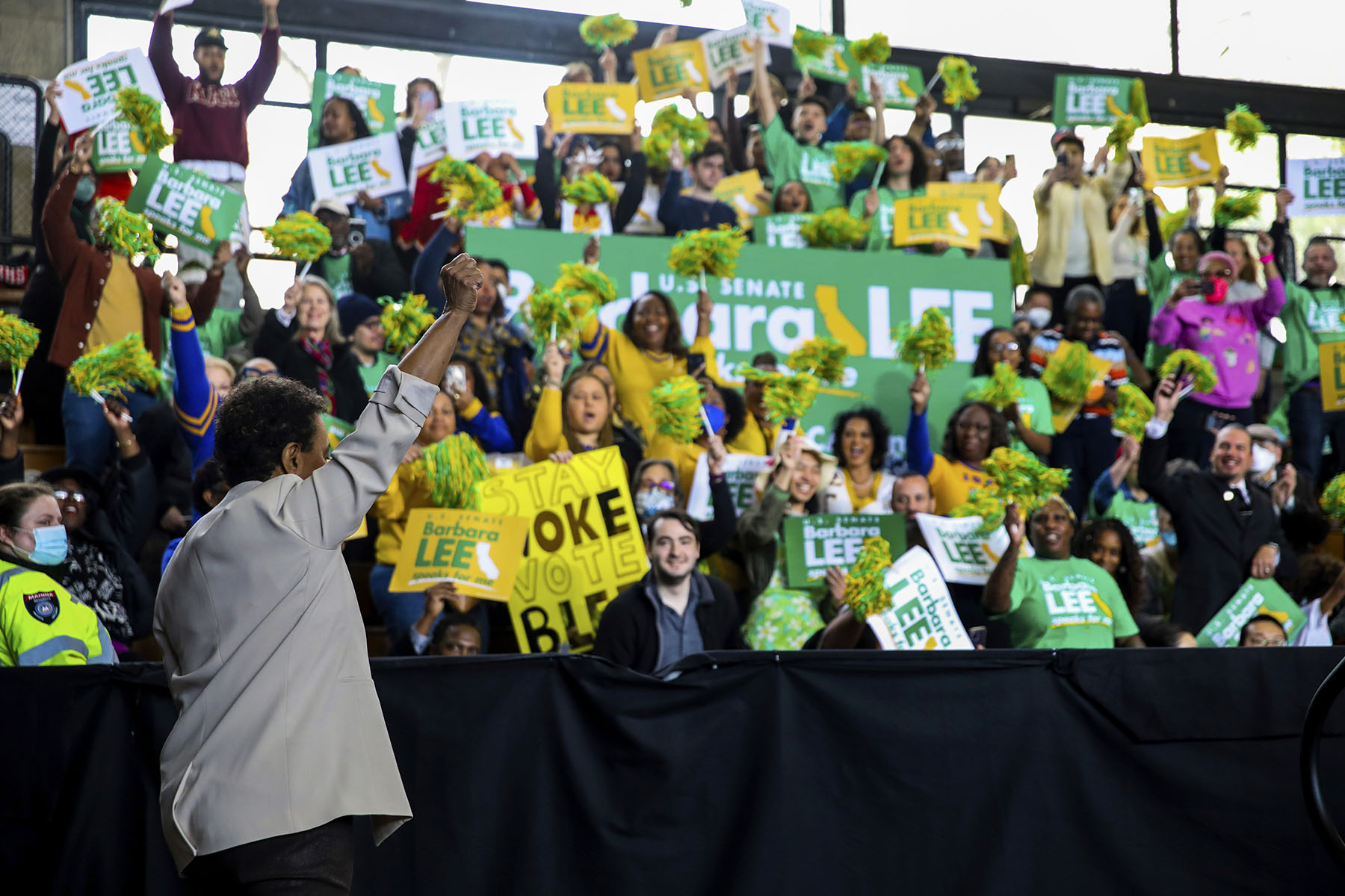 Lee walks to the stage with a raised fist during the launch of her Senate campaign.