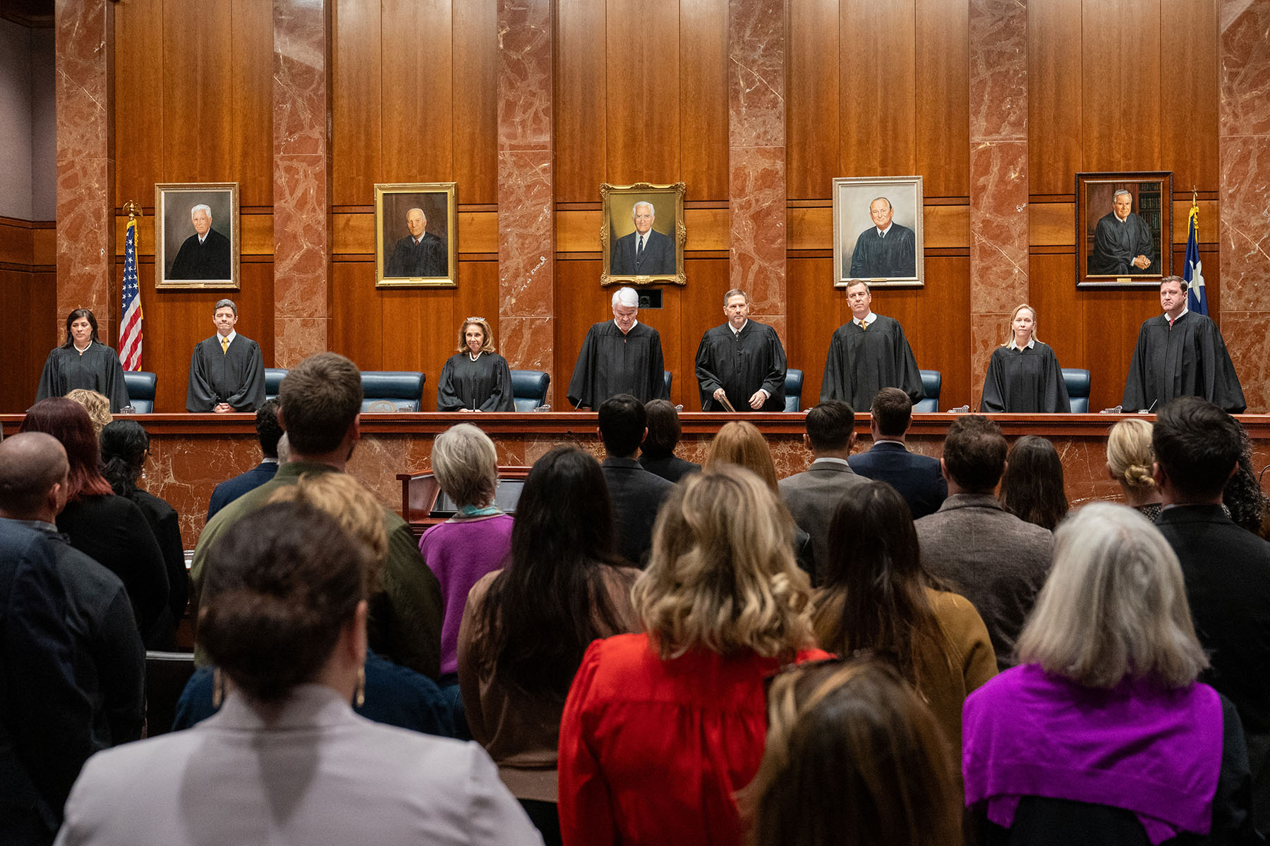 Justice Rebeca Aizpuru Huddle, Justice Brett Busby, Justice Debra Lehrmann, Chief Justice Nathan L. Hecht, Justice Jeff Boyd, Justice Jimmy Blacklock, Justice Jane Bland, and Justice Evan A. Young, of the Texas Supreme Court, arrive to hear litigators make their arguments at the Texas Supreme Court.