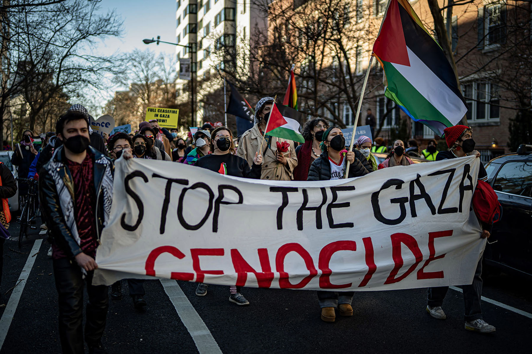 Protesters hold a banner that read "Stop the Gaza Genicide" as they march in Washington, D.C.