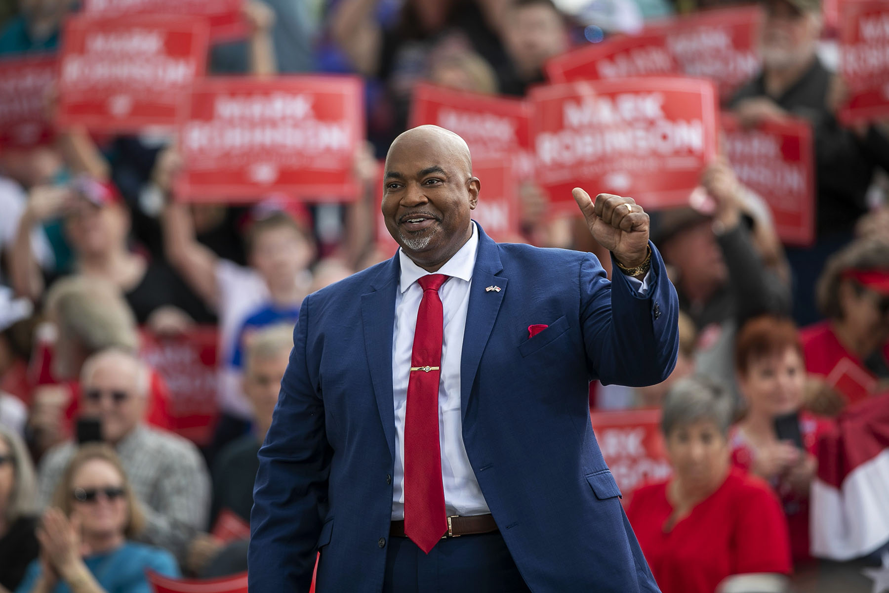 Lt. Gov. Mark Robinson waves at a crowd during a rally.
