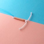IUD on pink and blue background