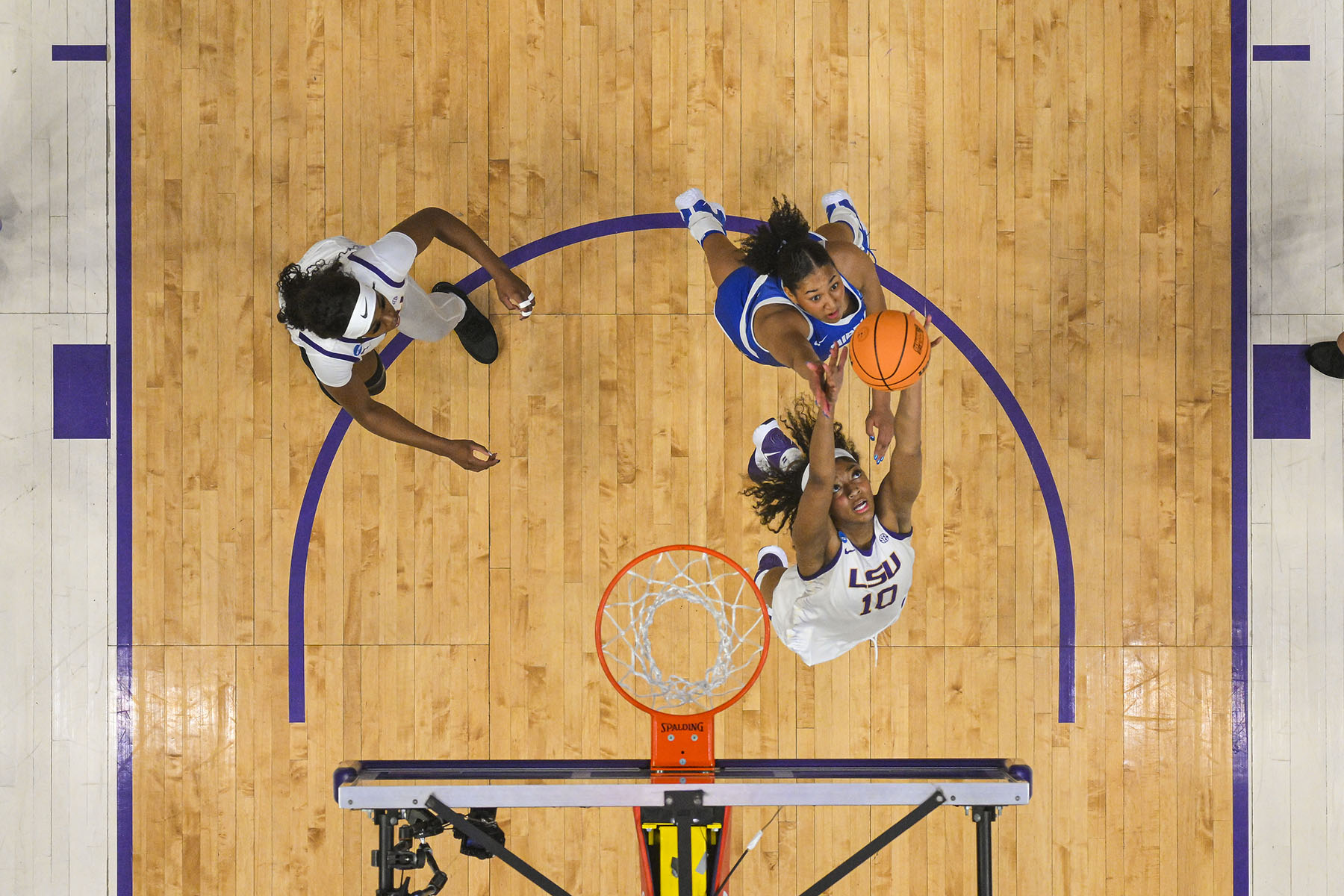 Angel Reese of the LSU Tigers and Jada Grannum of the Middle Tennessee Blue Raiders jump for a rebound during the second round of the 2024 NCAA Women's Basketball Tournament.