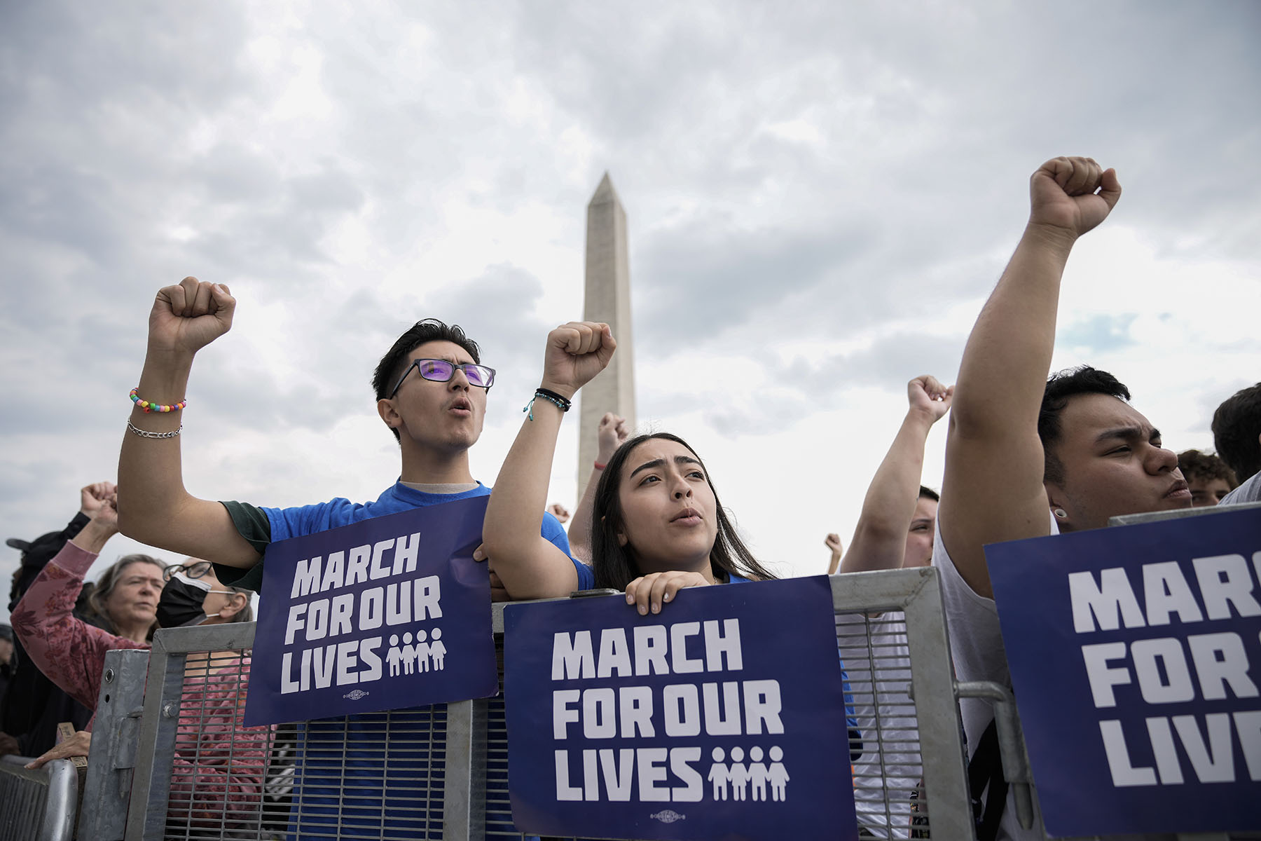 Demonstrators hold their fists up as they chant during a March for Our Lives rally against gun violence on the National Mall.