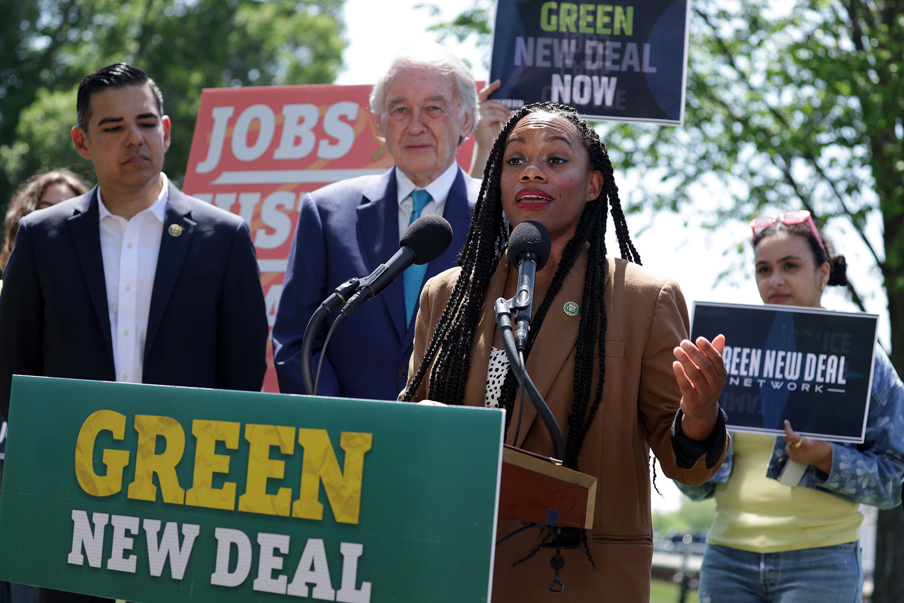Rep. Summer Lee speaks as Sen. Ed Markey and other participants listen during a news conference on the “Green New Deal.”