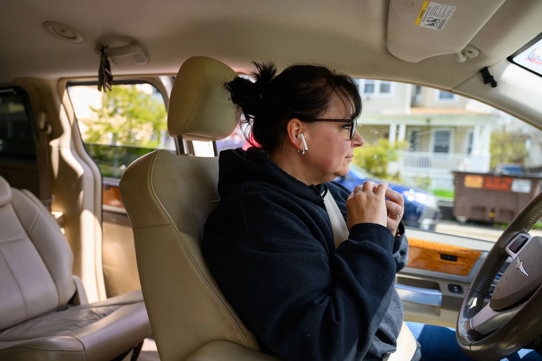 Tracy Shumaker, who works at a reentry organization, drives several formerly incarcerated people to their residence in Hartford, Connecticut.