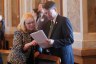 Kansas state Reps. Susan Concannon and Fred Patton confer during a session of the House.