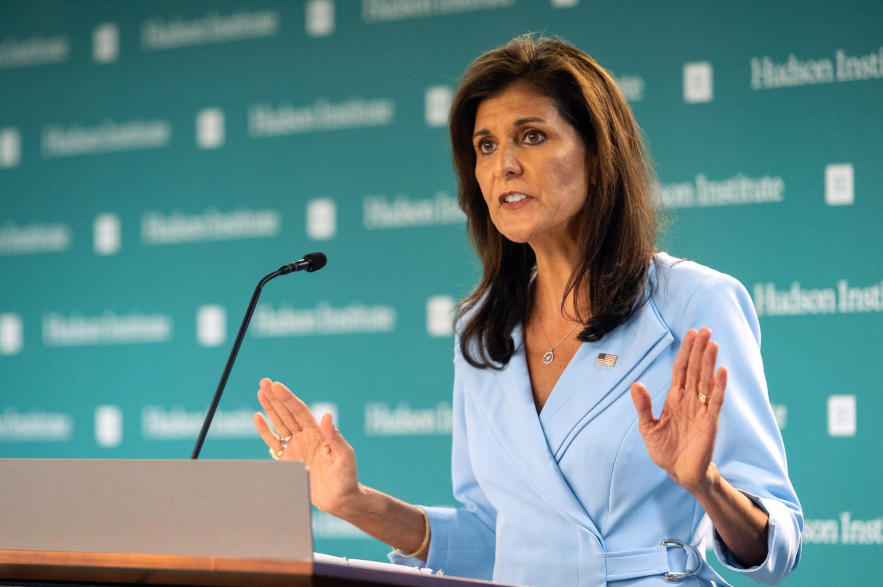 Nikki Haley stands in front of a microphone