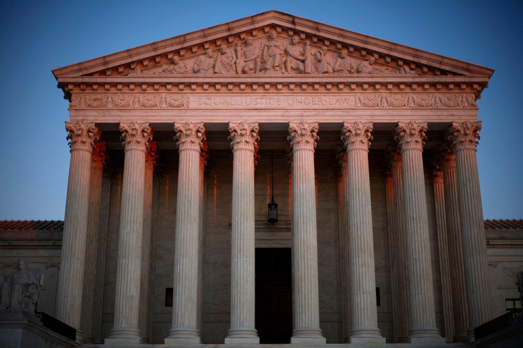 The U.S. Supreme Court is seen at dawn.