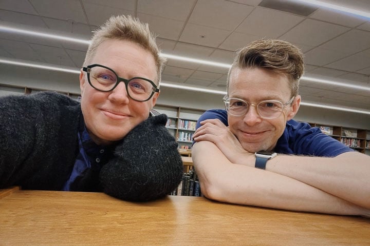 Drabinski takes a selfie with Tom Bober inside a library.