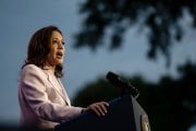 Kamala Harris is seen giving a speech at the podium.