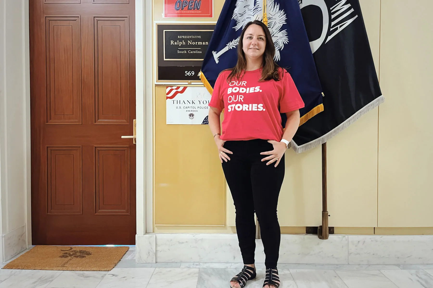 Lacey Layne poses for a portrait in front of the office of Rep. Ralph Norman.