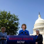 Sen. Tina Smith speaks during a press conference with Sens. Maggie Hassan and Patty Murray in front of the Capitol.