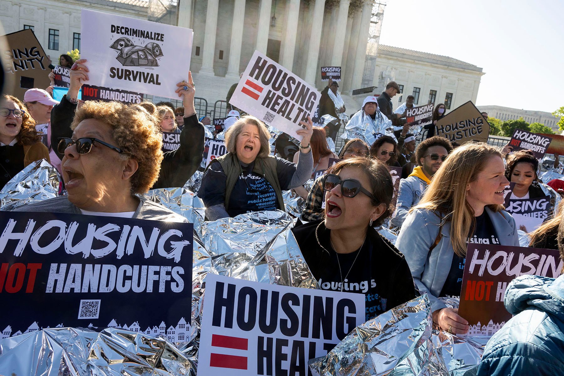 Homeless advocates take part in the "Housing Not Handcuffs" rally in front of the Supreme Court.