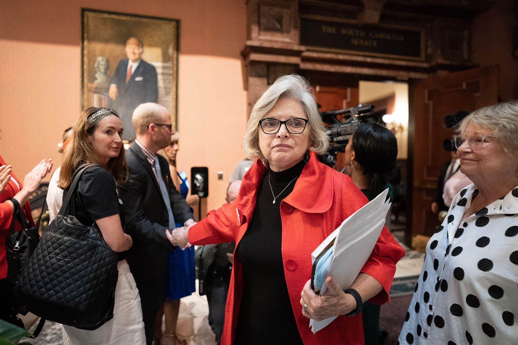 Republican state Sen. Katrina Shealy receives applause from supporters as she walks through the South Carolina Capitol.