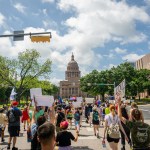 People march to the Texas State Capitol during a Queer March demonstration.