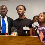 Malachi Hill Massey, flanked by civil right attorney Ben Crump and Sonya Massey's daughter, Jeanette Summer Massey, speaks at a news conference at the NAACP headquarters.