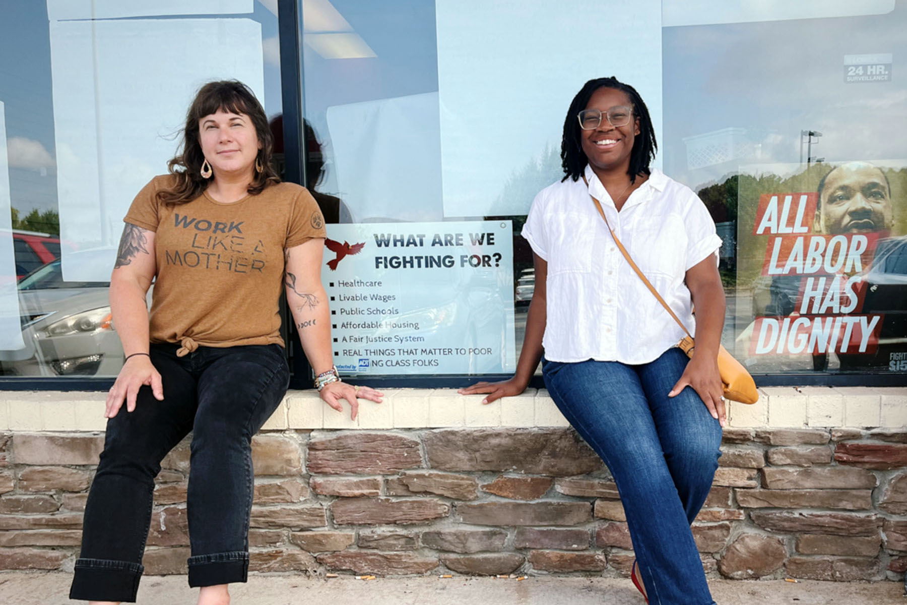 Gwen Frisbie-Fulton (left) and Taí Coates-Wedde pose for a photo outside Down Home N.C.'s office.