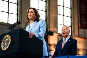 Vice President Kamala Harris speaks at a campaign event at Girard College in Philadelphia. President Biden stands behind her and smiles.