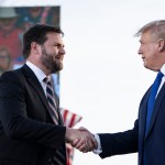 JD Vance shakes hands with former President Donald Trump during a rally.