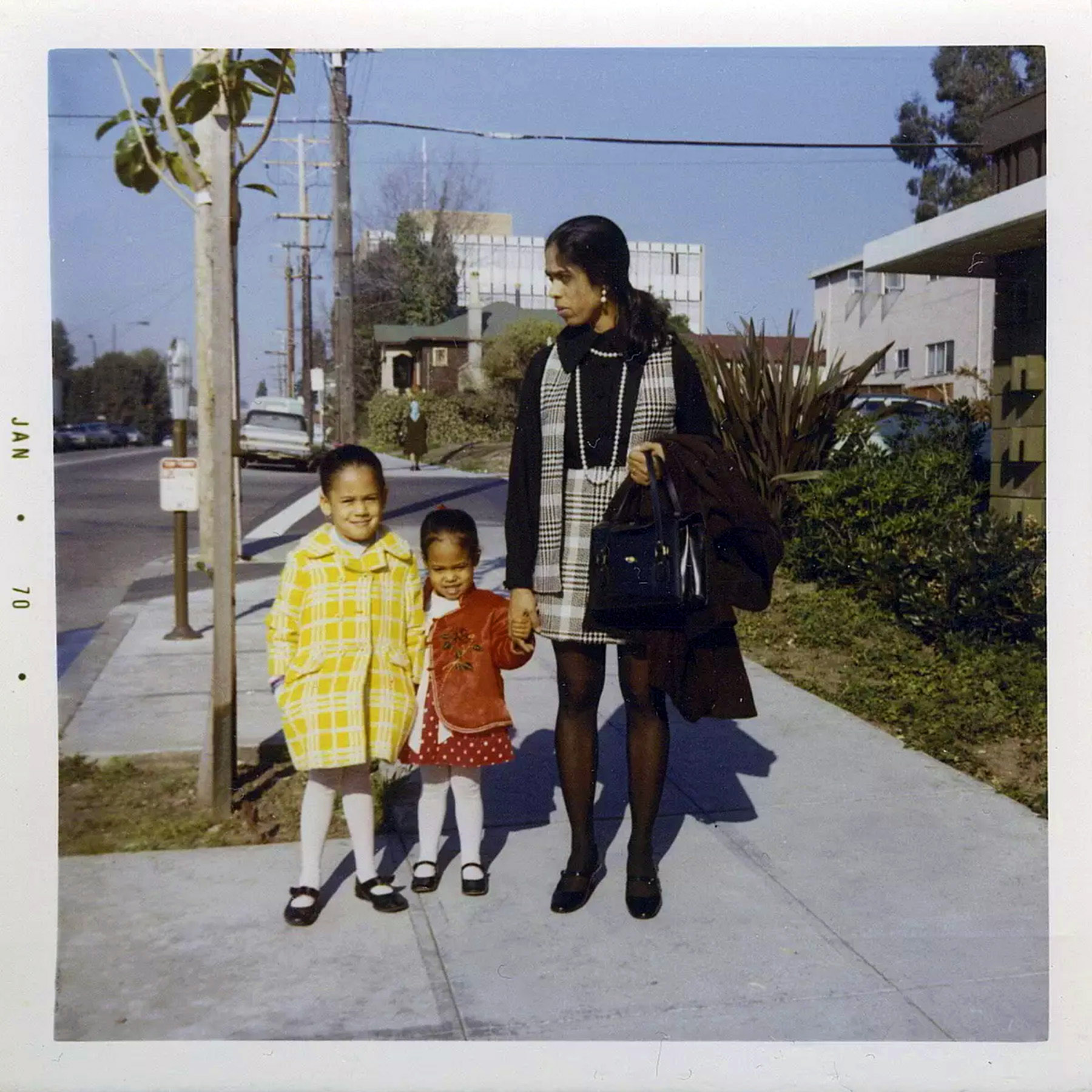 Kamala Harris (left) stands with her sister, Maya, and mother, Shyamala, in Berkeley, California, in 1970.