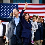 Kamala Harris holds her niece Amara as she and her husband Douglas Emhoff wave to the crowd after her first presidential campaign rally.