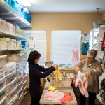 Volunteers organize baby clothes at an anti-abortion center in California.