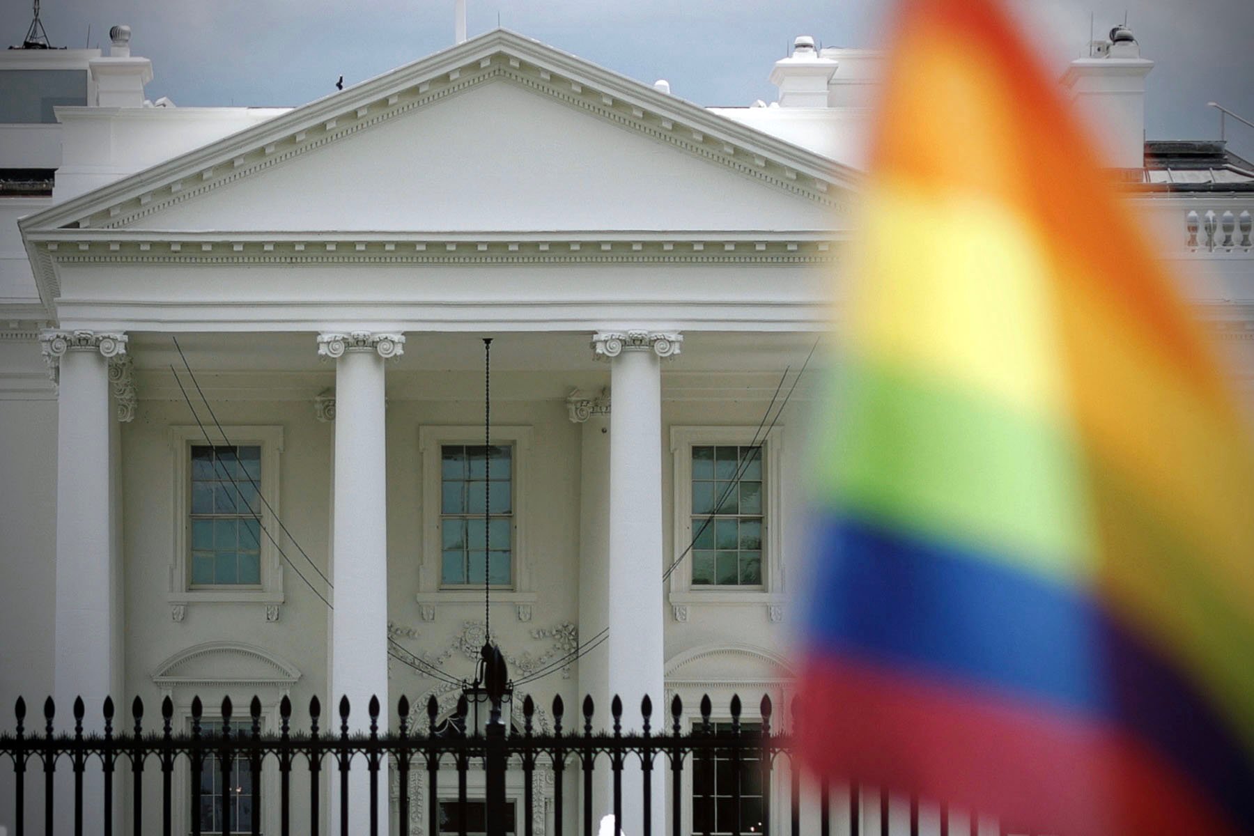 A pride flag is seen in front of the White House.
