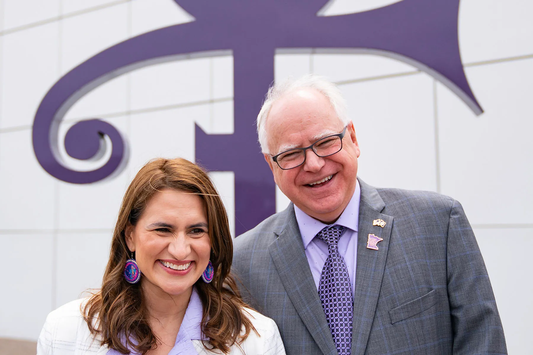 Minnesota Lieutenant Governor Peggy Flanagan and Governor Tim Walz pose for a photo together at Paisley Park.