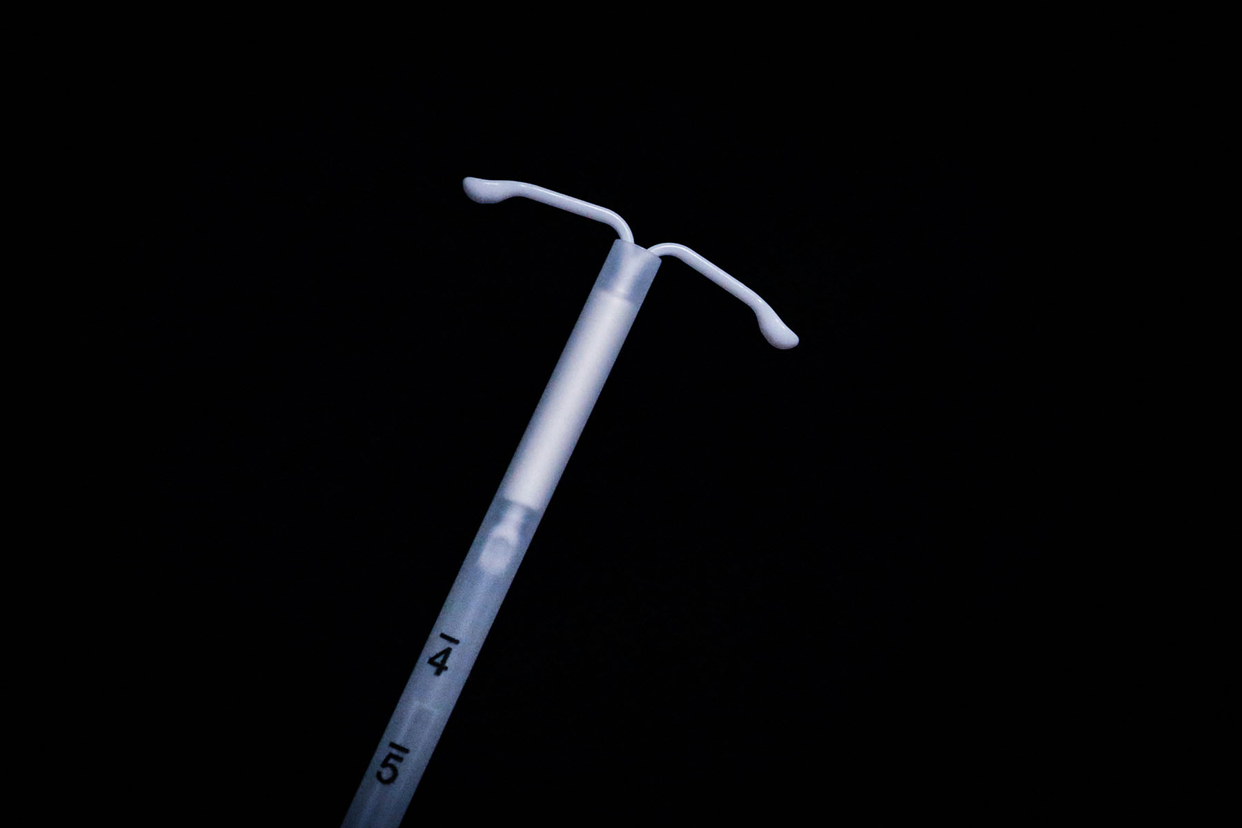 photograph of a a hormonal intrauterine contraceptive device.