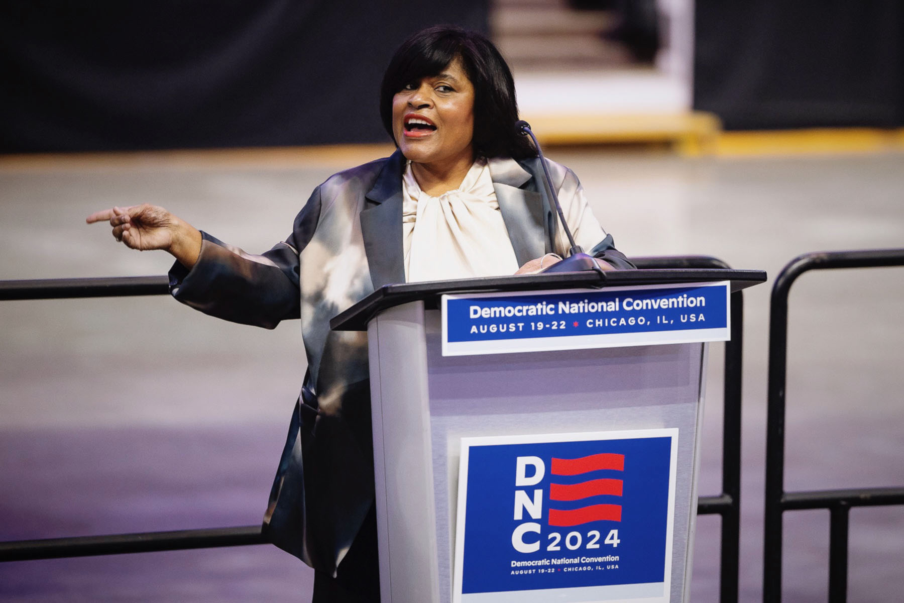 Minyon Moore speaks from a podium during a media walk-through for the 2024 Democratic National Convention.