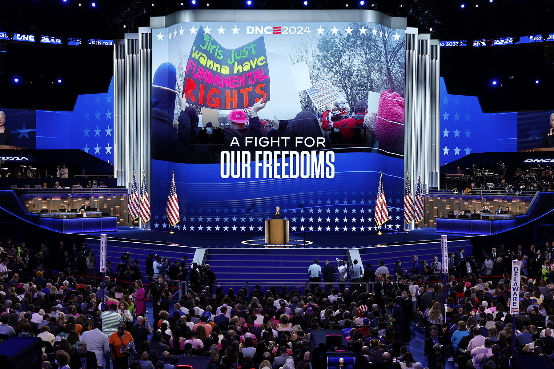 Former President of Planned Parenthood Cecile Richards speaks on stage during the third day of the DNC. Behind her the screen reads "A Fight for Our Freedoms."