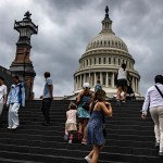 Visitors walk towards the Capitol building in Washington, D.C.