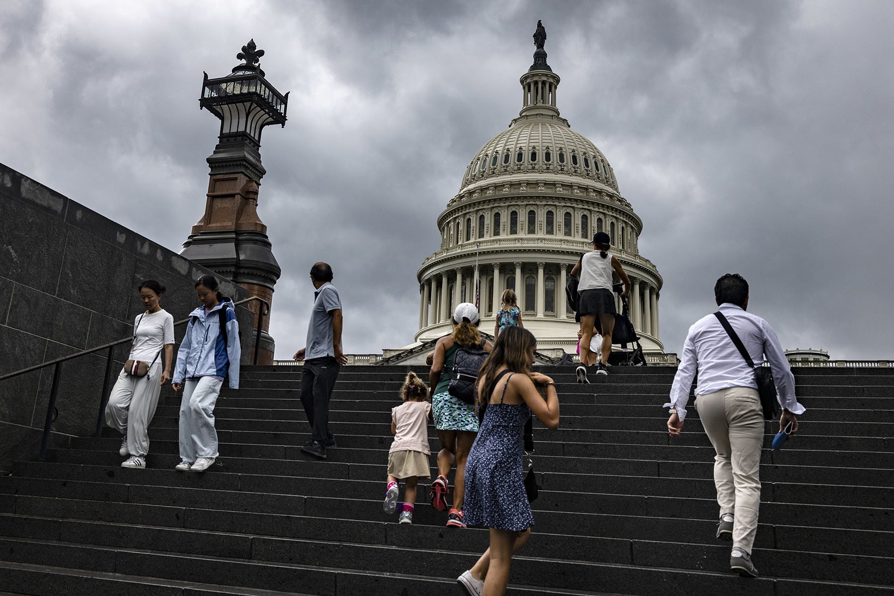 Visitors walk towards the Capitol building in Washington, D.C.