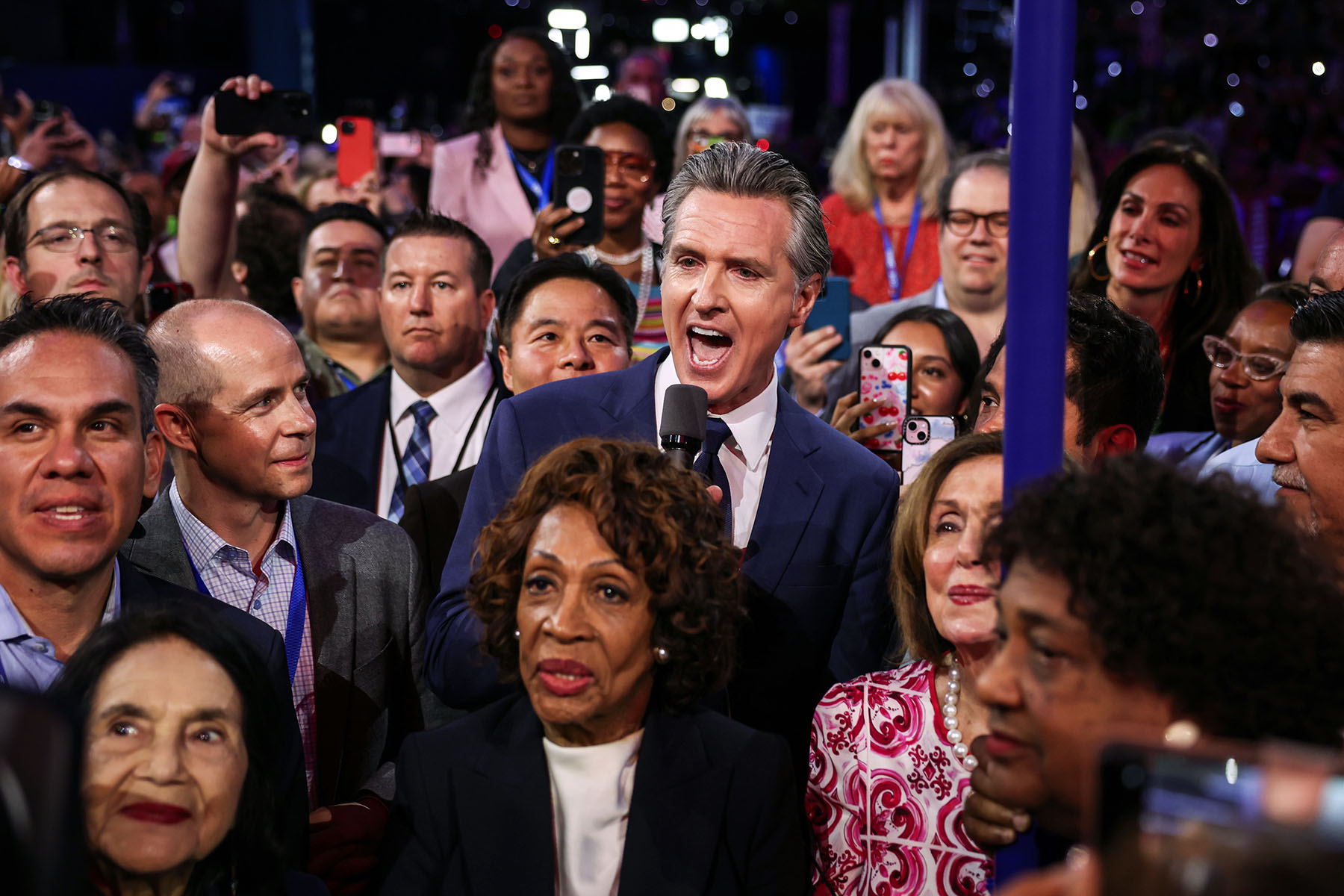 California Gov. Gavin Newsom joins the California delegation as they cast their votes during the Ceremonial Roll Call of States.